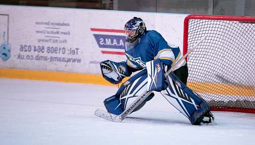 ice hockey ice hockey goalie defending the goal person